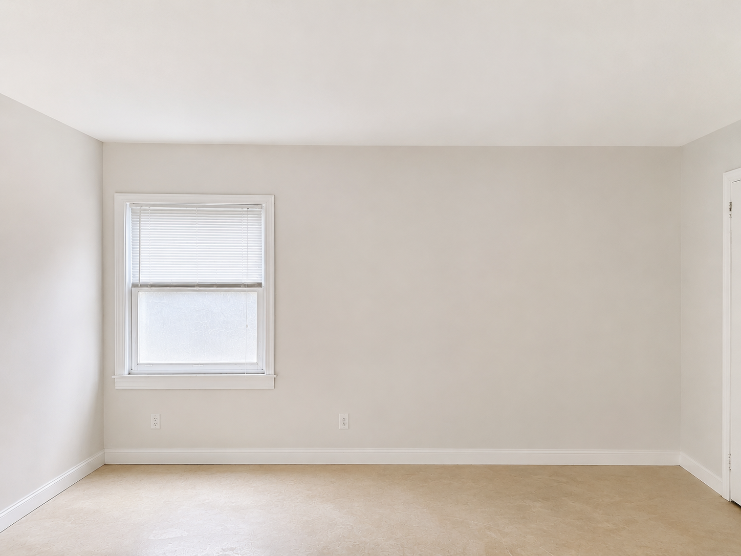 Room with smooth, painted walls after the work